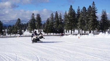 Feel the wind in your hair and cure your need for speed on our snowmobile track. #TahoeSnowmobiles ❄️