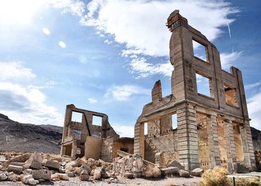 At the peak of its boom, Rhyolite had it all. Swimming pools, baseball teams, the opera, brothels, saloons, gambling tables, hospitals, schools...the list goes on. They even had a weekly newspaper and monthly magazine!

For a goldrush era boomtown that lasted only from 1904 to 1919, Rhyolite certainly made its mark. Today, it is one of the most-photographed ghost town in Nevada's Old West. .
.
.
To learn more about this once-glittering town, head to the link in bio to read 