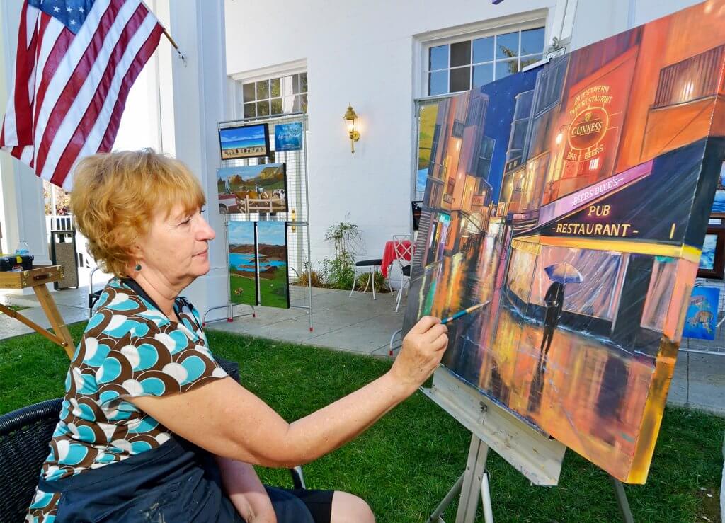 woman painting at art in the park