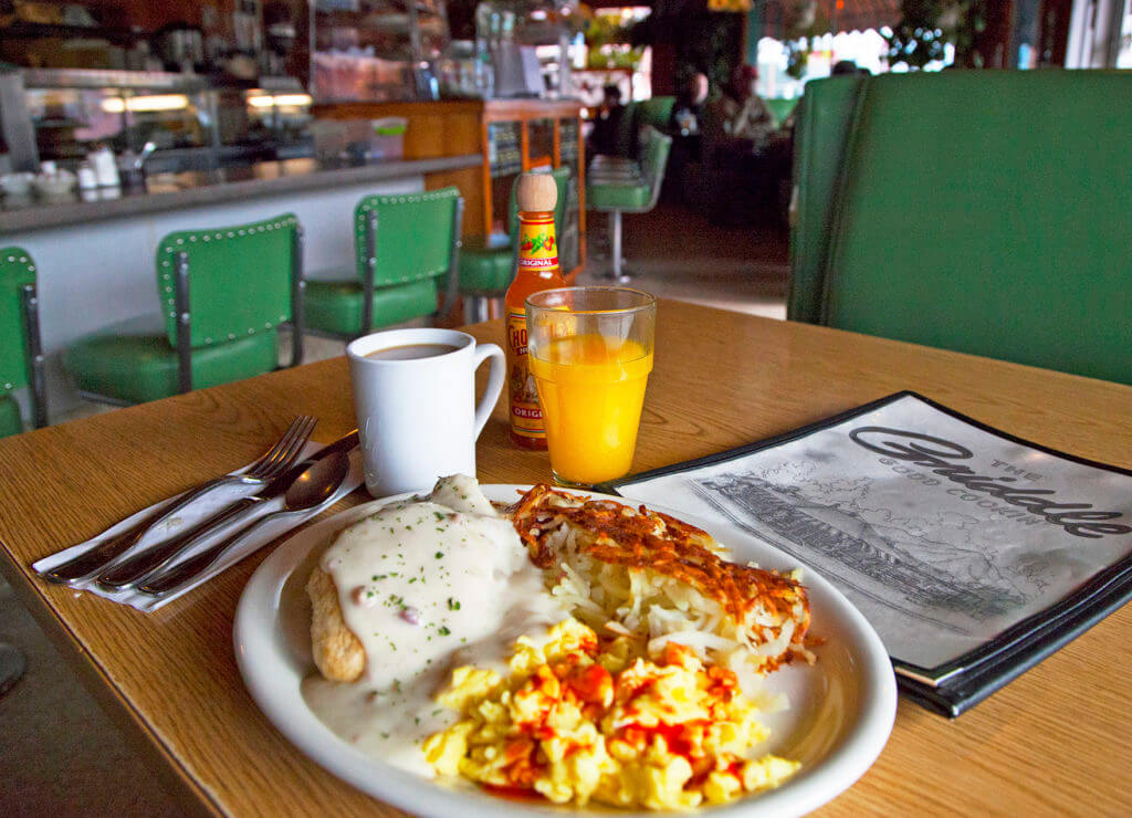 breakfast plate with coffee and orange juice at the griddle