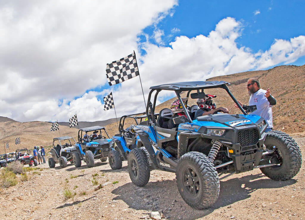blue off road vehicles lined up on las vegas off roading trails