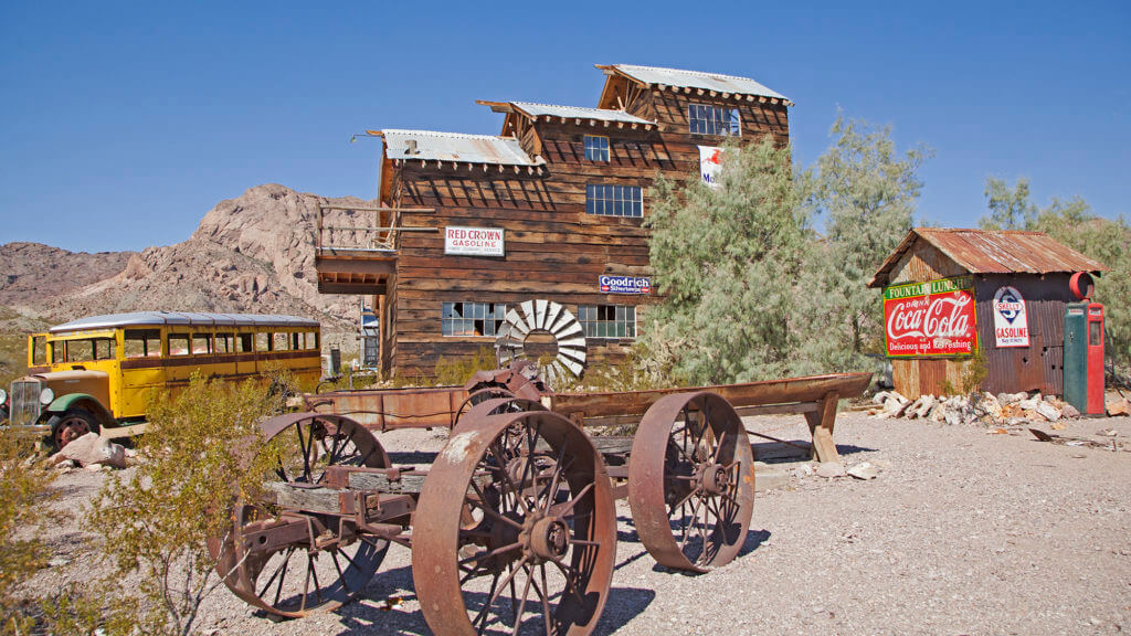 old building and stagecoach at techatticup ghost town